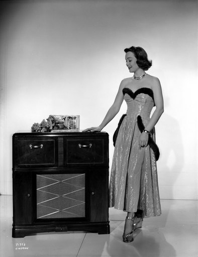 Jane Wyman Posed in White Silk Strapless Dress with Black Fur Belt Around and Below the Waist Photo Print (24 X 30)
