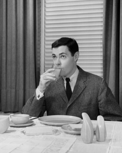 Mid Adult Man Drinking Juice Stretched Canvas - (24 X 36)
