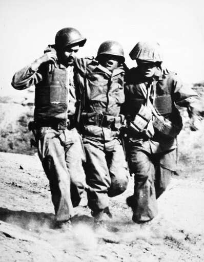 Korean War Pork Chop Hill Nan American Soldier Wounded at the Battle of Pork Chop Hill in 1953 Receives Assistance from Two Comrades Stretched Canvas