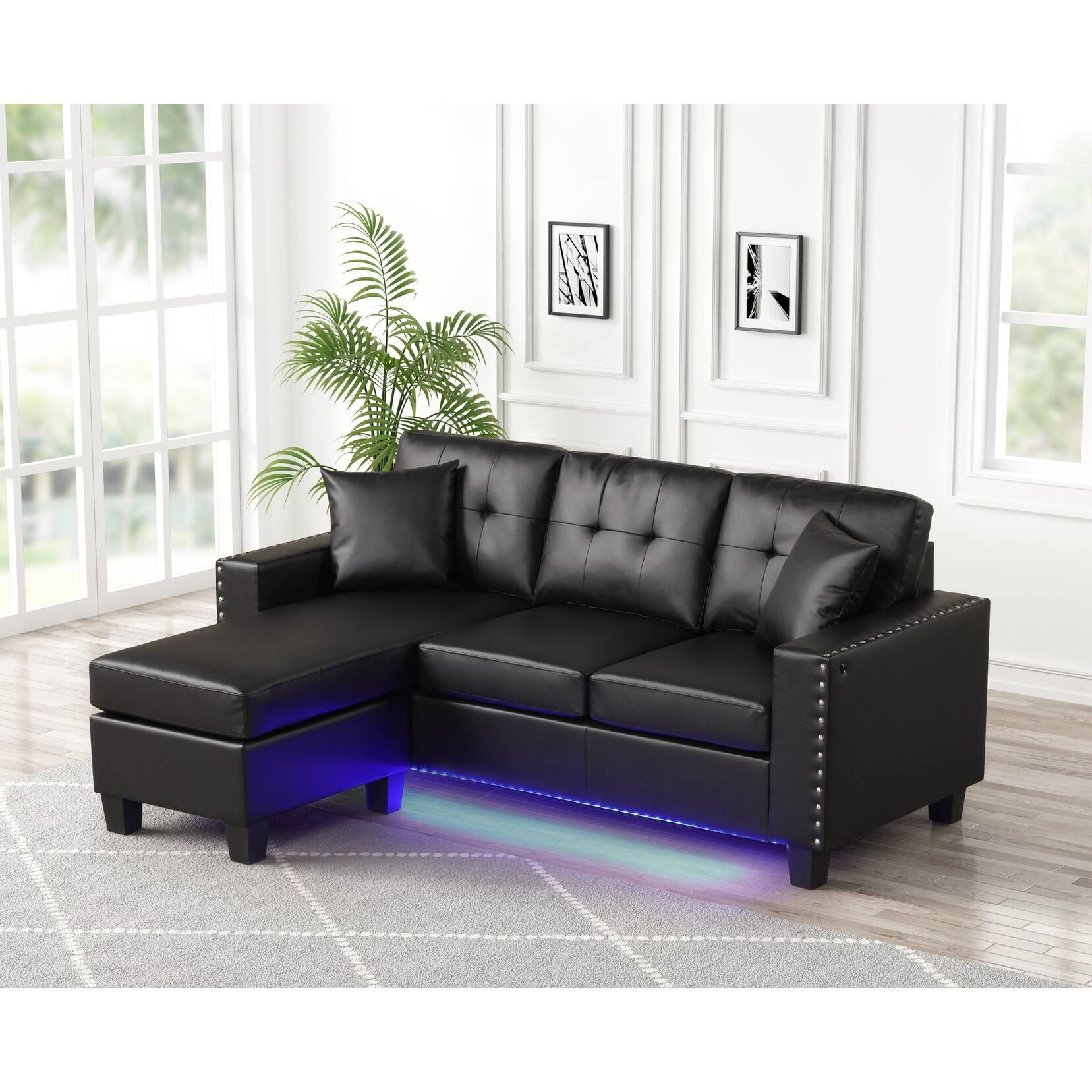 Wyman Black Faux Leather Tufted Reversible Sectional